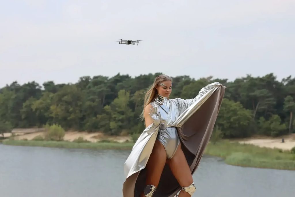 Lara Deutz with space suit in naturea